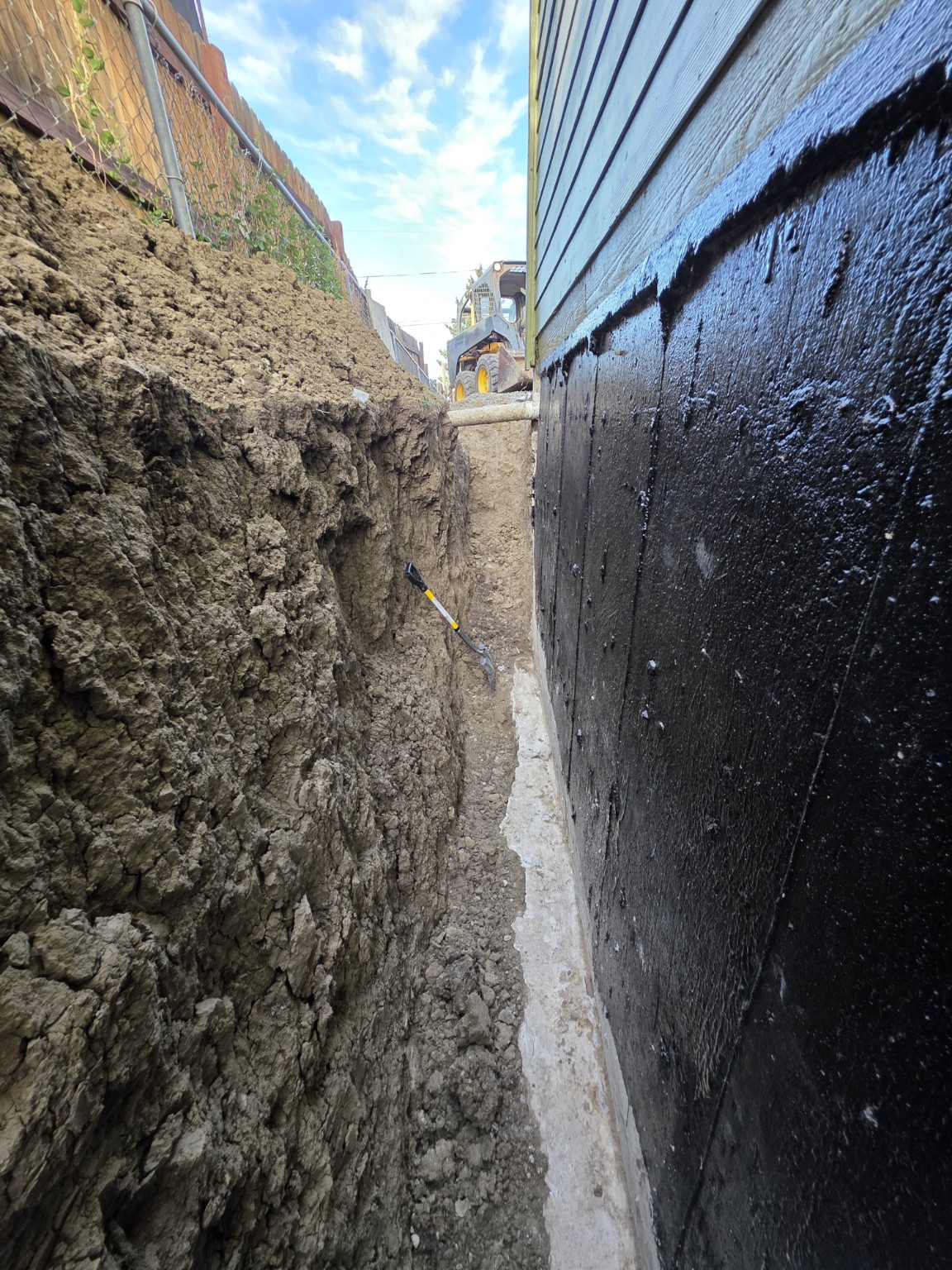 Foundation wall exposed for exterior repair and waterproofing